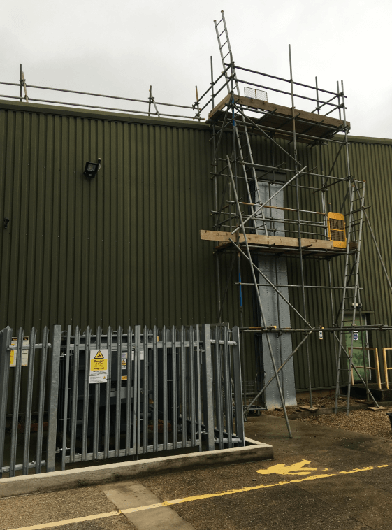 Access tower with roof edge protection handrail, RPC Containers, Oakham